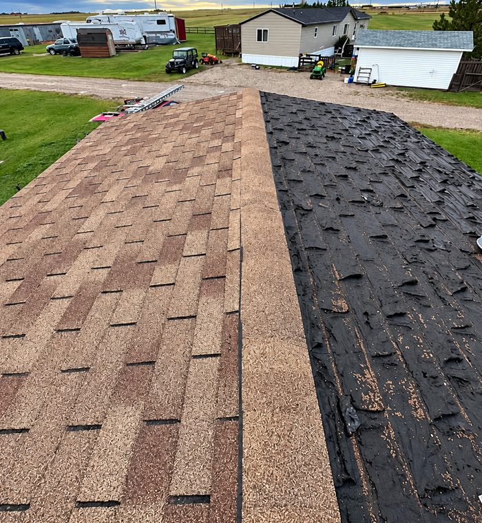 Completed residential roof replacement with architectural asphalt shingles