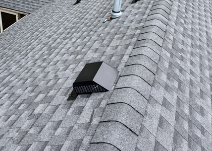 Roof valley repair with metal flashing between two asphalt shingle roof slopes