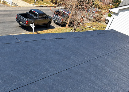 Completed flat roof membrane repair on a commercial low-slope roofing system