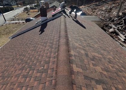 Complete residential asphalt shingle roof replacement with newly installed roofing materials