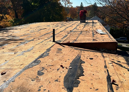 Roof leak repair addressing damaged roofing materials and areas of water intrusion