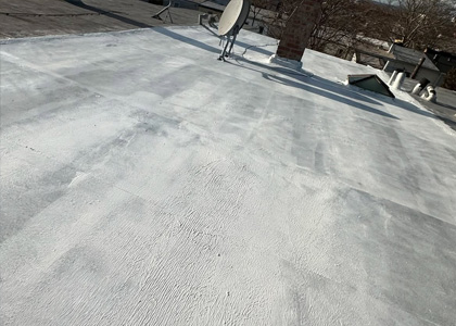 Flat roof membrane repair and restoration on a low-slope roofing system